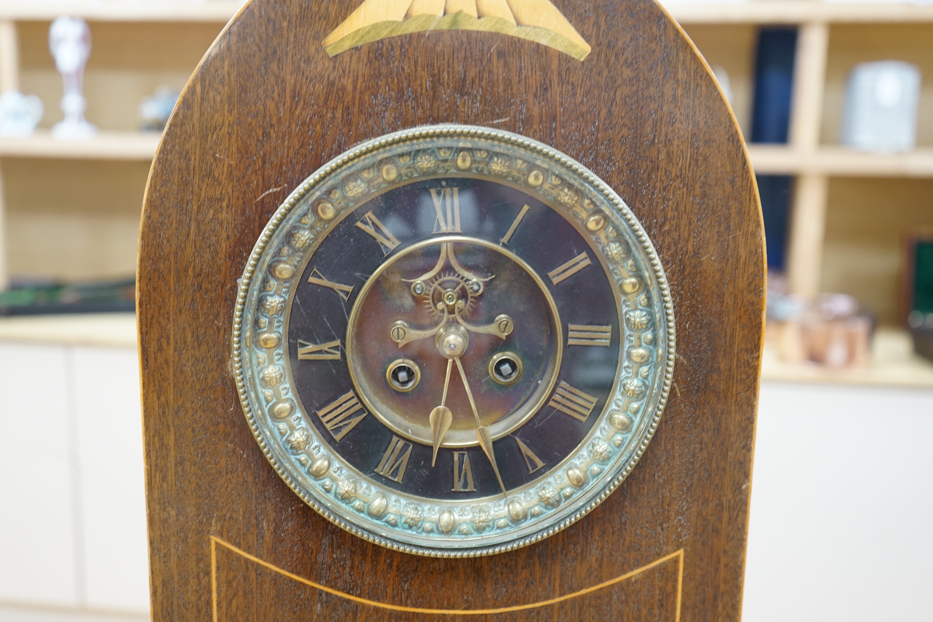 A late 19th century shell inlaid mahogany eight day lancet topped bracket clock, 56cm high. Condition - case good, clock lacking pendulum, untested if working.